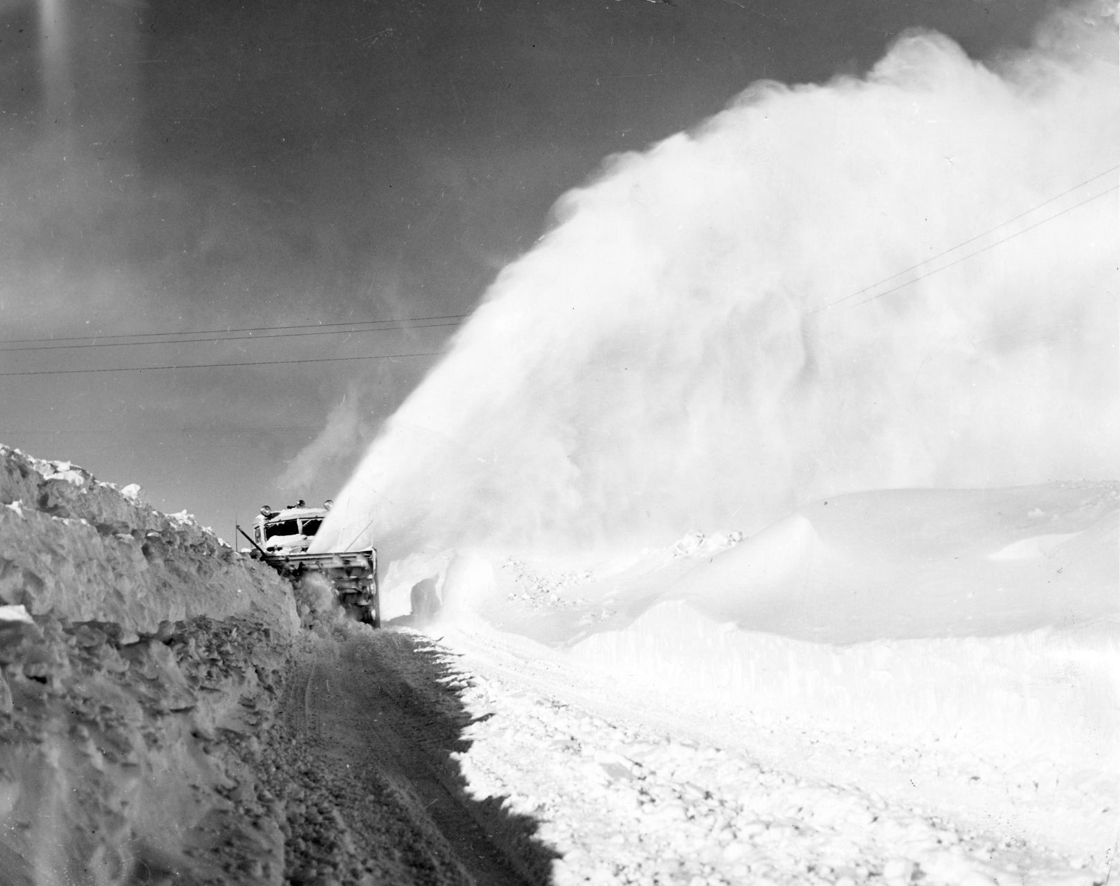 This big Army rotary snowplow actually growled as it attacked huge drifts on Highway 212, near Faith, South Dakota US Army photo. Published in February 1949.